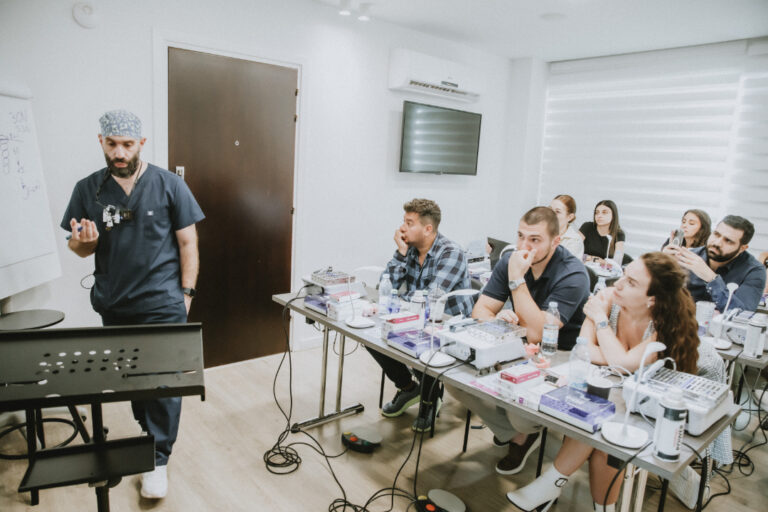 Medical professional training lecture with engaged participants.
