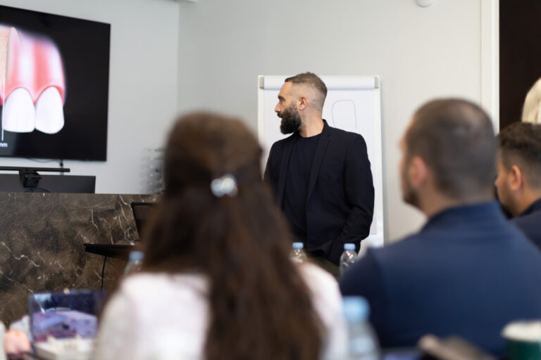 Man giving dental presentation to audience.
